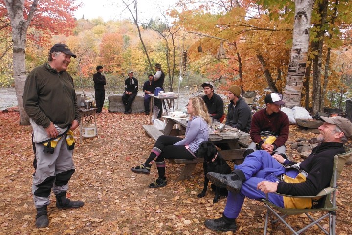 a group of people sitting at a park