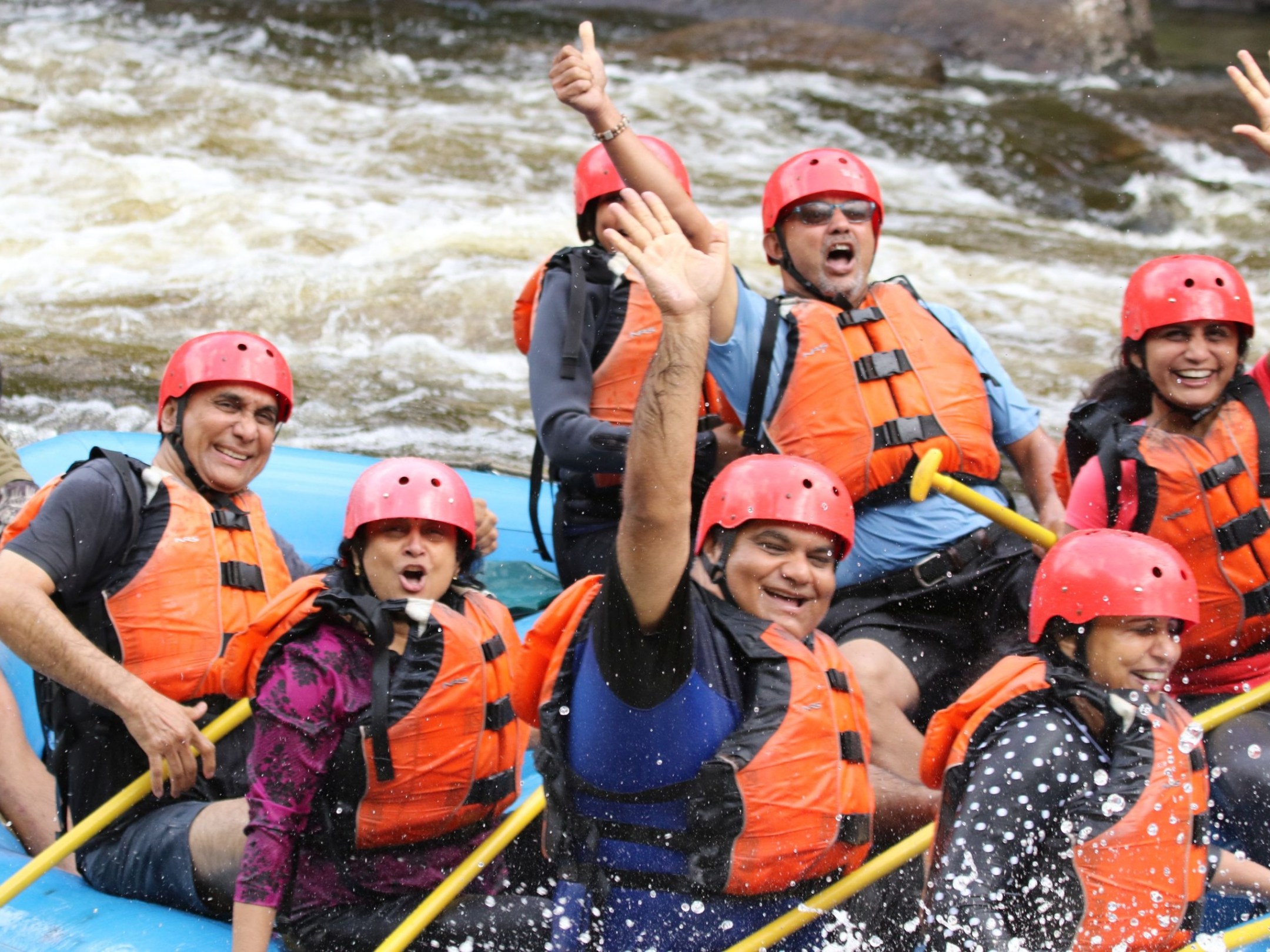 a group of people on a raft in the water