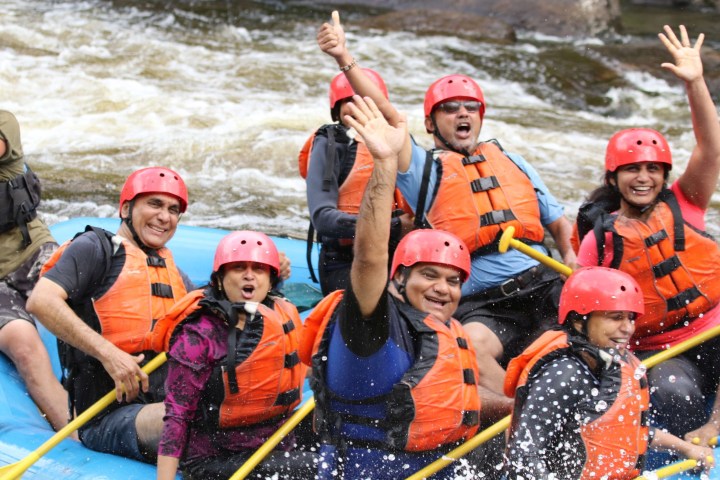 a group of people on a raft in the water