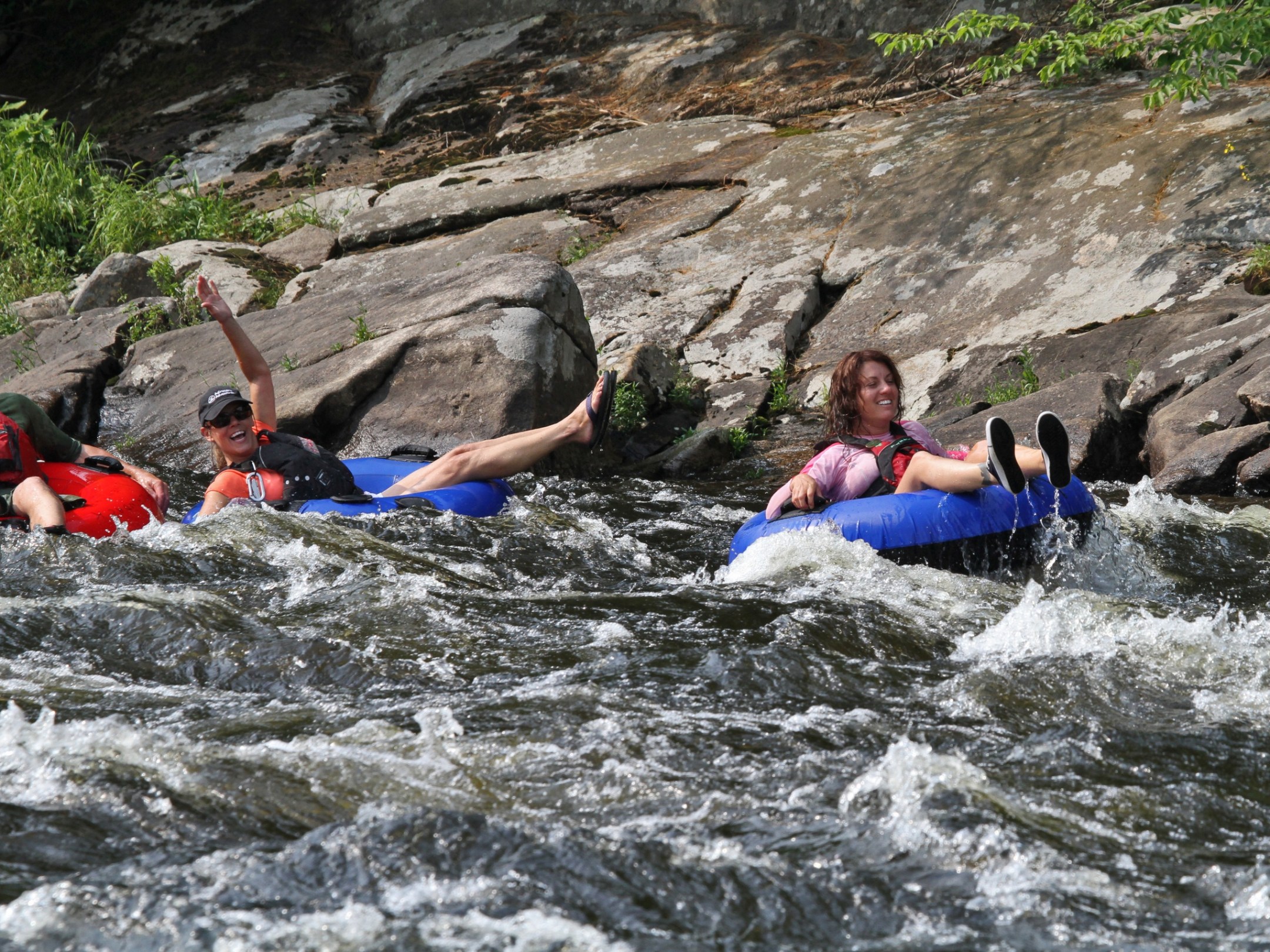 a group of people lying in a body of water